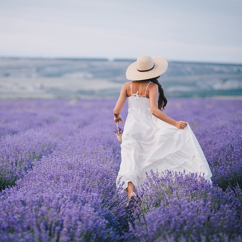 girl running in lavender field